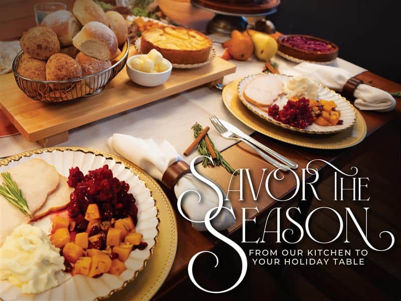 Zoomed in picture of a holiday table setting, with plated food.