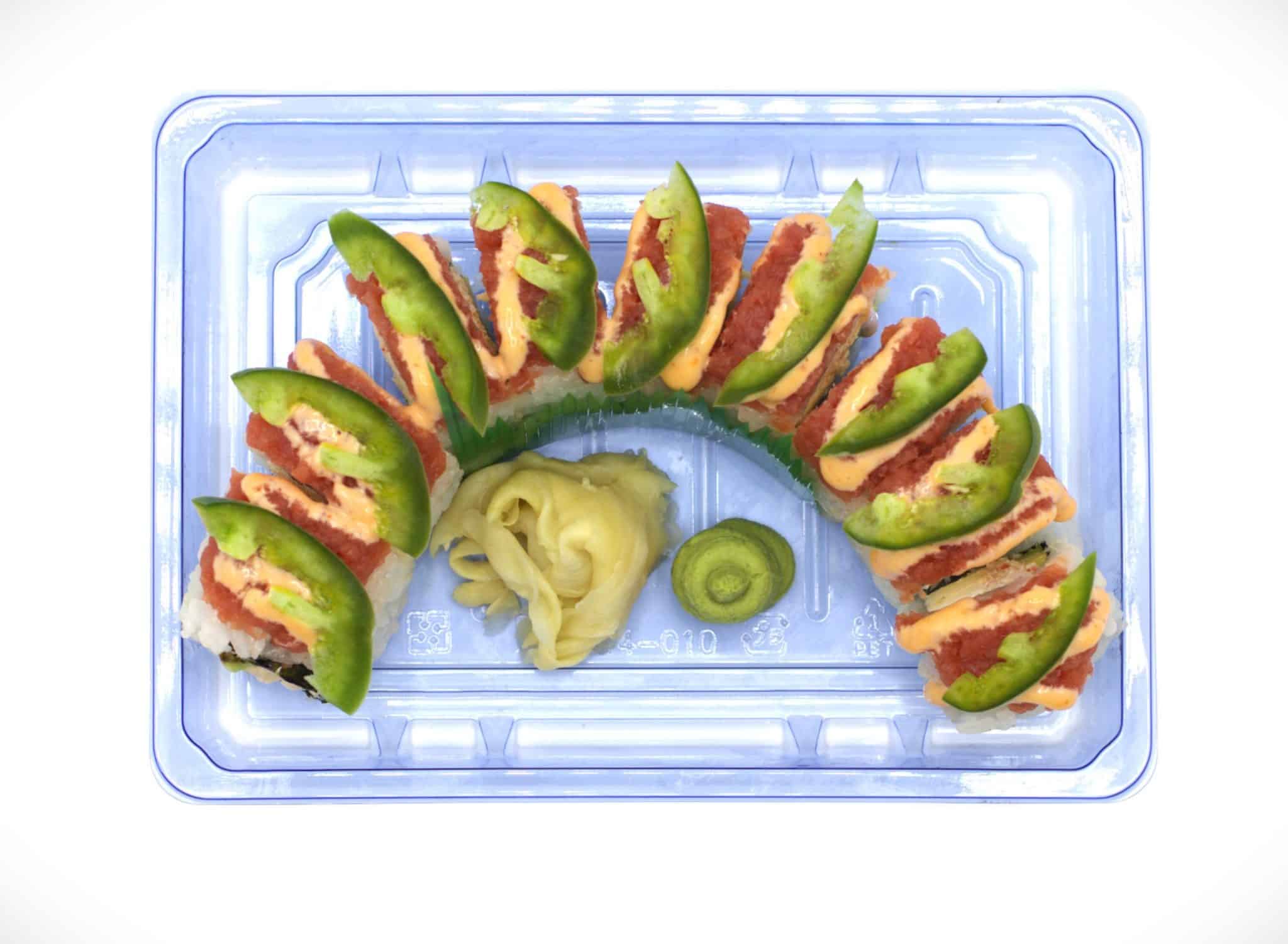 Hatch Chili Roll topped with avocado and spicy hatch chili sauce