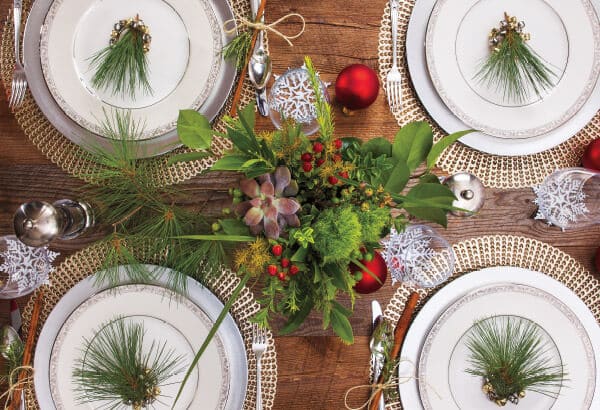 A festive dining table, adorned with Christmas decorations, and pine cones in Ann Arbor, Michigan