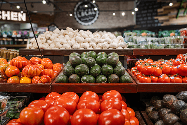 Produce, including tomatoes and avocados, on display at Busch's