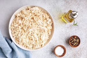 Image of Shredded chicken meat in a big bowl.