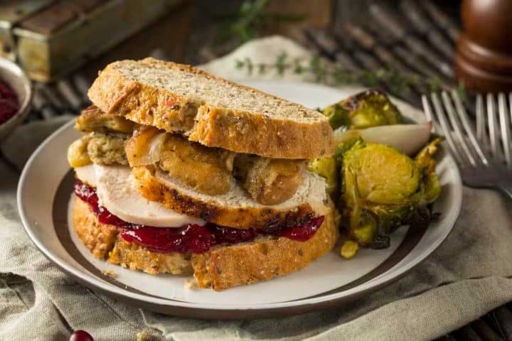 Turkey, stuffing, and cranberry sandwich with Brussels sprouts served in Ann Arbor, MI